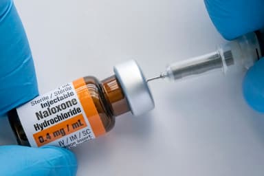 Mandating Pharmacy Co-Dispensing of Naloxone With High-Risk Opioid Prescriptions